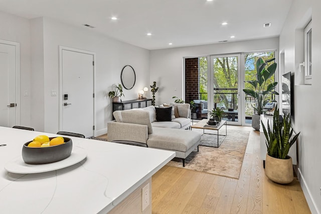 4906 N Kenmore Ave Unit 2S, Chicago, IL 60640 - living area featuring light wood-type flooring, recessed lighting, and baseboards