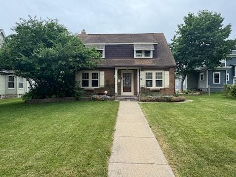 309 11th Ave, Sterling, IL 61081 - view of front facade with a front yard