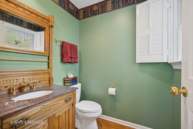 22585 N Ruth Ct, Kildeer, IL 60047 - bathroom with toilet, baseboards, vanity, and wood finished floors