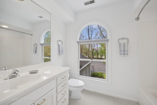 22585 N Ruth Ct, Kildeer, IL 60047 - full bathroom featuring plenty of natural light, toilet, vanity, and baseboards