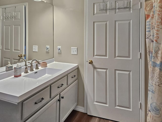 1409 Hull St, Normal, IL 61761 - full bathroom featuring vanity, wood finished floors, and baseboards