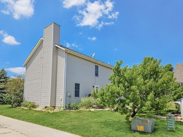 1409 Hull St, Normal, IL 61761 - view of property exterior with a chimney and a lawn
