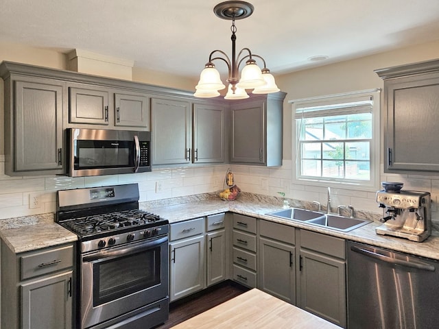 1409 Hull St, Normal, IL 61761 - kitchen featuring appliances with stainless steel finishes, gray cabinets, a sink, and light countertops