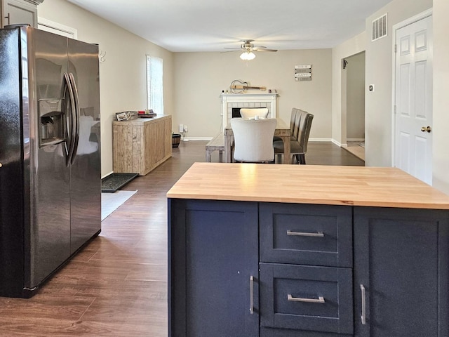 1409 Hull St, Normal, IL 61761 - kitchen with stainless steel refrigerator with ice dispenser, butcher block counters, a ceiling fan, dark wood finished floors, and open floor plan