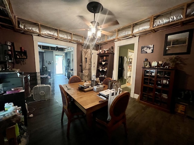 207 W 2nd St, Broadlands, IL 61816 - dining room featuring ceiling fan and dark wood-type flooring