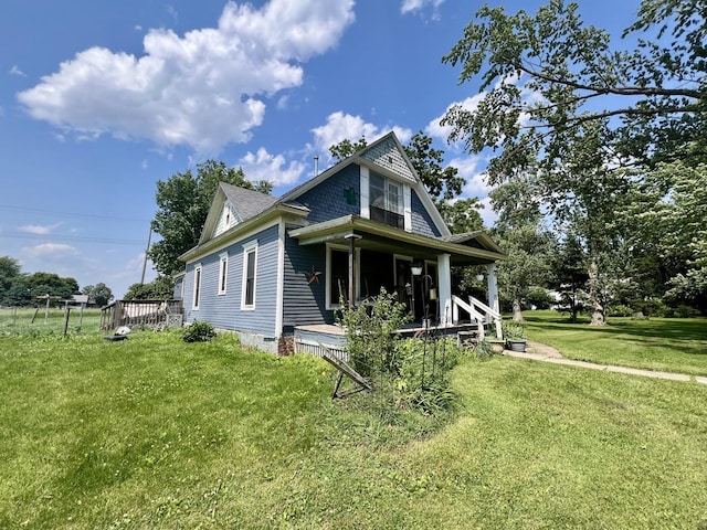 207 W 2nd St, Broadlands, IL 61816 - view of home's exterior featuring a porch