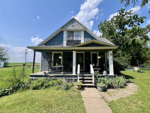 207 W 2nd St, Broadlands, IL 61816 - victorian-style house featuring a front lawn and a porch