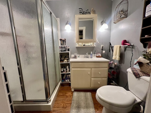 207 W 2nd St, Broadlands, IL 61816 - bathroom with vanity, a shower stall, and wood finished floors