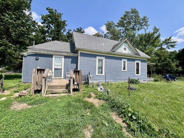 207 W 2nd St, Broadlands, IL 61816 - rear view of property with a deck and a yard