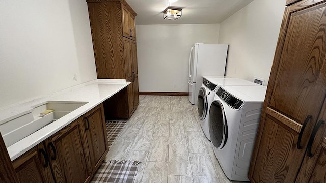 15501 Bishop Rd, Morrison, IL 61270 - laundry room with independent washer and dryer and cabinet space
