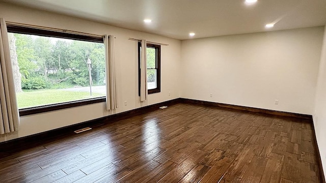 15501 Bishop Rd, Morrison, IL 61270 - empty room with dark wood finished floors, recessed lighting, and baseboards
