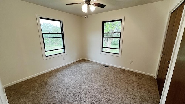 15501 Bishop Rd, Morrison, IL 61270 - carpeted empty room featuring a ceiling fan and baseboards