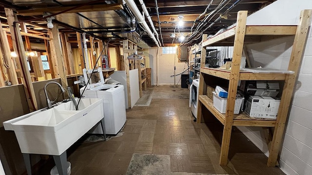15501 Bishop Rd, Morrison, IL 61270 - below grade area with washer and dryer, a sink, and tile patterned floors
