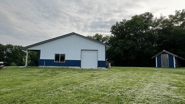 15501 Bishop Rd, Morrison, IL 61270 - view of property exterior with an outbuilding, a garage, and a yard
