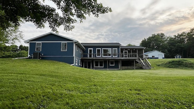 15501 Bishop Rd, Morrison, IL 61270 - back of house featuring a deck, central AC, a lawn, and stairs