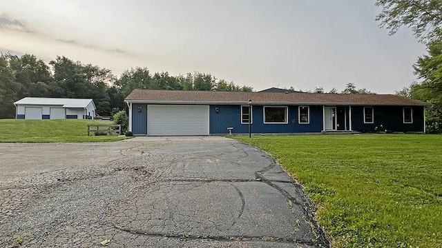 15501 Bishop Rd, Morrison, IL 61270 - ranch-style home with a garage, driveway, a front lawn, and covered porch