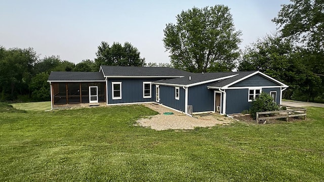 15501 Bishop Rd, Morrison, IL 61270 - rear view of property featuring a sunroom and a lawn