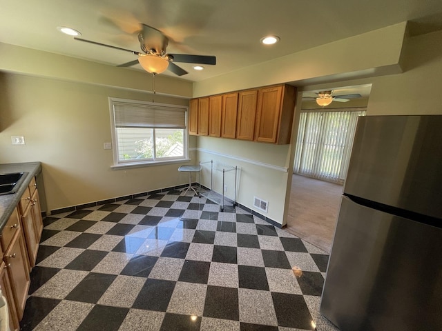 11 Shagbark Rd, Lake Bluff, IL 60044 - kitchen with freestanding refrigerator, a ceiling fan, brown cabinets, recessed lighting, and a sink