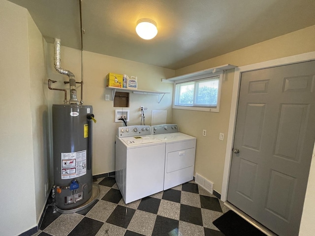 11 Shagbark Rd, Lake Bluff, IL 60044 - laundry room featuring gas water heater, dark flooring, washer and clothes dryer, and baseboards
