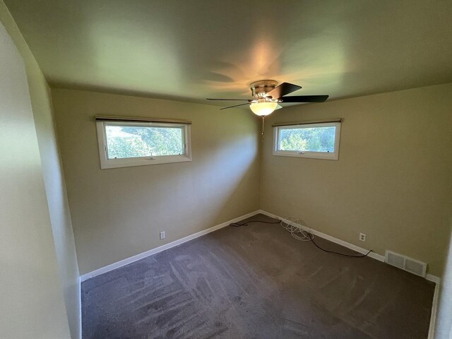 11 Shagbark Rd, Lake Bluff, IL 60044 - spare room featuring a ceiling fan, dark colored carpet, and baseboards