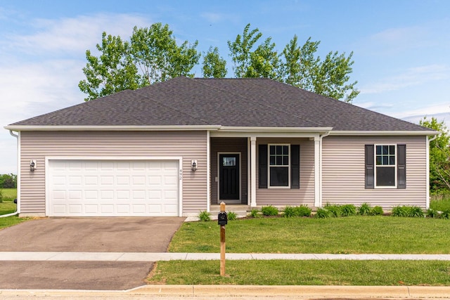492 S Hampstead St, Cortland, IL 60112 - single story home featuring a front lawn, driveway, covered porch, an attached garage, and a shingled roof
