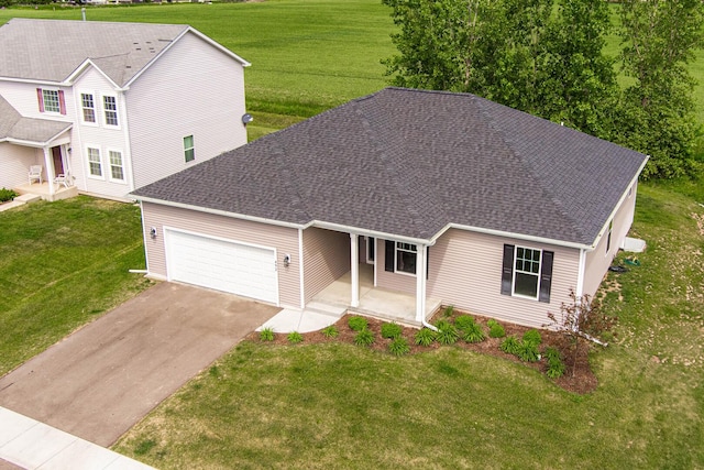 492 S Hampstead St, Cortland, IL 60112 - view of front of home featuring driveway, a garage, covered porch, a front lawn, and a shingled roof