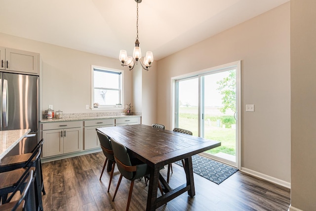 492 S Hampstead St, Cortland, IL 60112 - dining room featuring a chandelier, dark wood finished floors, baseboards, and vaulted ceiling