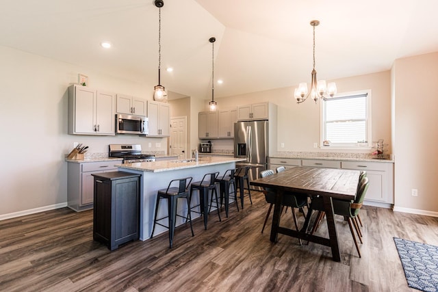 492 S Hampstead St, Cortland, IL 60112 - kitchen featuring stainless steel appliances, a chandelier, dark wood-style floors, a sink, and an island with sink