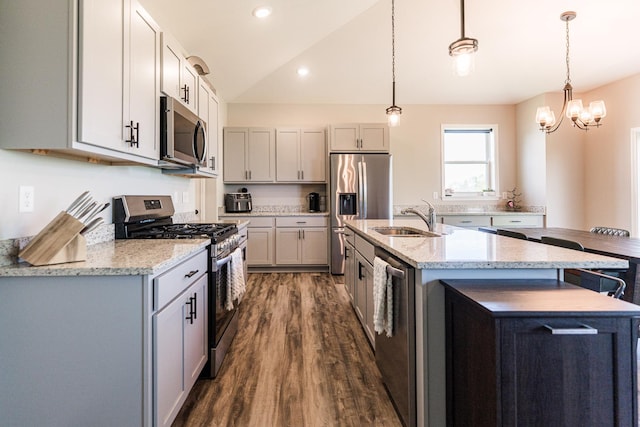 492 S Hampstead St, Cortland, IL 60112 - kitchen featuring appliances with stainless steel finishes, a sink, dark wood-style floors, a center island with sink, and lofted ceiling