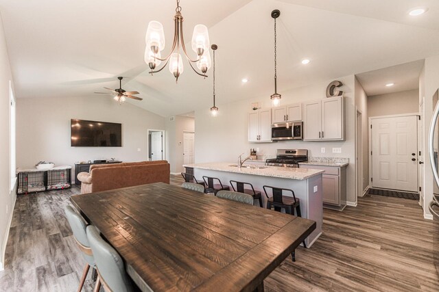 492 S Hampstead St, Cortland, IL 60112 - dining room featuring vaulted ceiling, dark wood-style floors, ceiling fan, a chandelier, and recessed lighting
