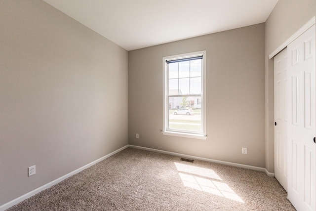 492 S Hampstead St, Cortland, IL 60112 - unfurnished bedroom with carpet floors, baseboards, and a closet