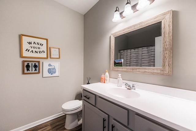 492 S Hampstead St, Cortland, IL 60112 - bathroom with vanity, toilet, wood finished floors, and baseboards