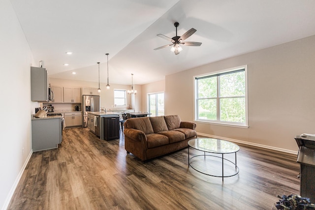 492 S Hampstead St, Cortland, IL 60112 - living area featuring dark wood-type flooring, lofted ceiling, baseboards, a ceiling fan, and a chandelier
