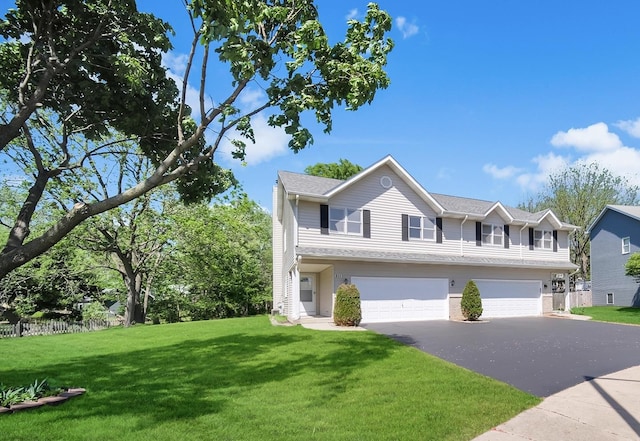 211 Lorien Ct, East Dundee, IL 60118 - view of front of house with asphalt driveway, an attached garage, and a front lawn