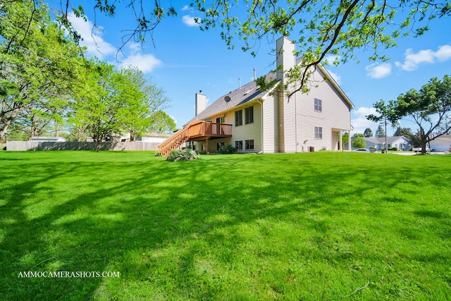 211 Lorien Ct, East Dundee, IL 60118 - rear view of house featuring stairs, a chimney, and a wooden deck