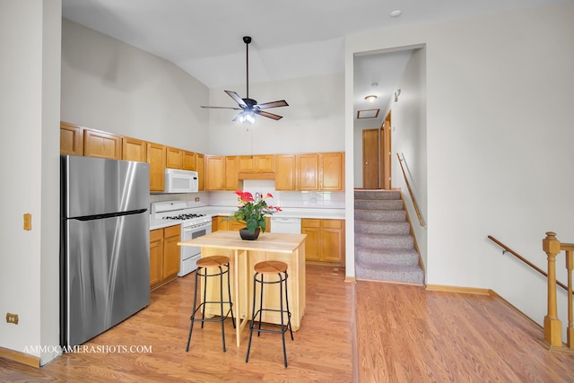 211 Lorien Ct, East Dundee, IL 60118 - kitchen with white appliances, a ceiling fan, light wood-type flooring, high vaulted ceiling, and baseboards