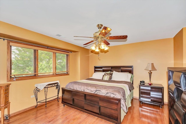 8702 Bally Castle Ln, Tinley Park, IL 60487 - bedroom featuring wood finished floors, baseboards, and a ceiling fan