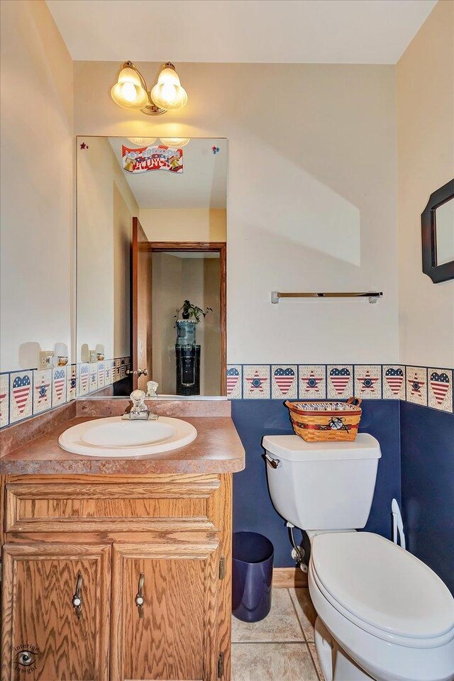 8702 Bally Castle Ln, Tinley Park, IL 60487 - half bathroom with toilet, vanity, and tile patterned floors