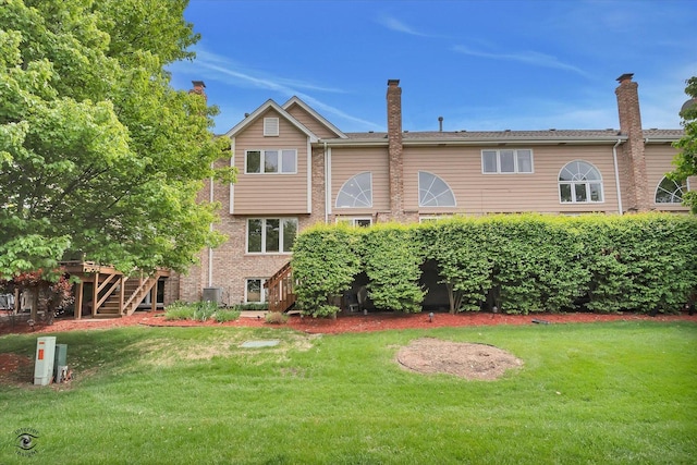 8702 Bally Castle Ln, Tinley Park, IL 60487 - rear view of property featuring stairs, a lawn, and brick siding