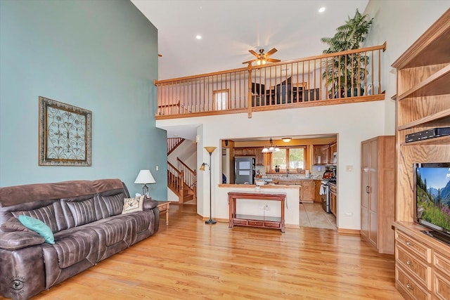 8702 Bally Castle Ln, Tinley Park, IL 60487 - living area featuring a high ceiling, stairway, a ceiling fan, light wood-style floors, and recessed lighting