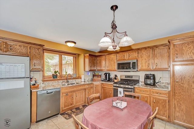 8702 Bally Castle Ln, Tinley Park, IL 60487 - kitchen featuring appliances with stainless steel finishes, a sink, decorative backsplash, and light tile patterned floors