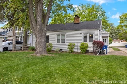 275 E Division St, Villa Park, IL 60181 - view of front of home featuring a chimney and a front lawn