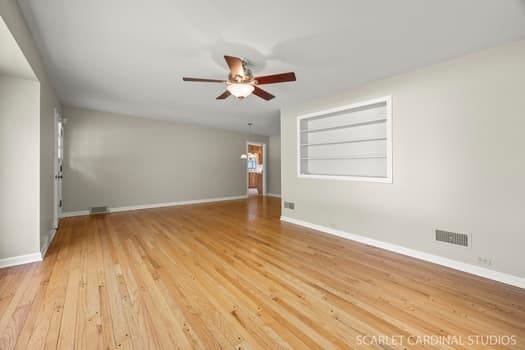 275 E Division St, Villa Park, IL 60181 - unfurnished room featuring a ceiling fan, light wood-style flooring, and baseboards