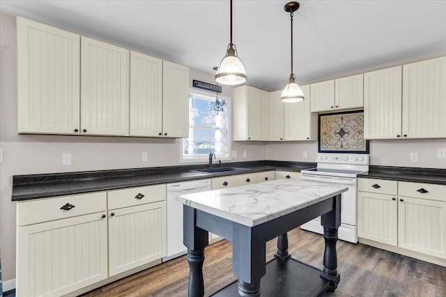 2225 County Road 1700 N, Saint Joseph, IL 61873 - kitchen with white appliances, a sink, dark wood-type flooring, decorative light fixtures, and dark countertops