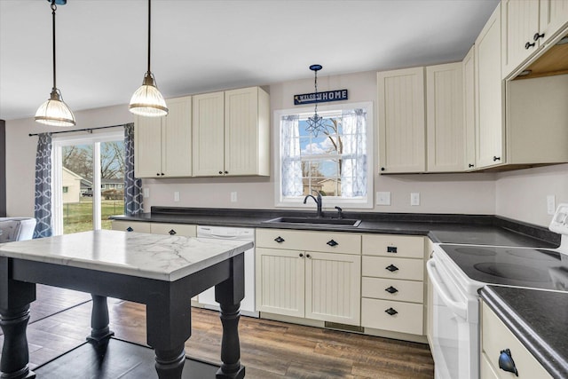 2225 County Road 1700 N, Saint Joseph, IL 61873 - kitchen featuring white appliances, a sink, dark countertops, dark wood-type flooring, and decorative light fixtures