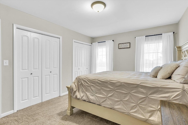 2225 County Road 1700 N, Saint Joseph, IL 61873 - carpeted bedroom featuring multiple closets and baseboards