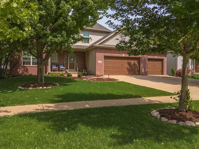 1710 Fraser Dr, Normal, IL 61761 - view of front facade featuring a garage, covered porch, concrete driveway, and a front lawn