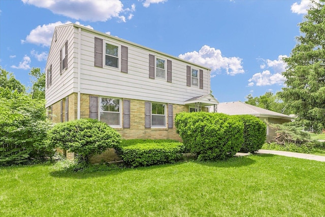 1117 W Springfield Ave, Champaign, IL 61821 - colonial-style house featuring a front yard