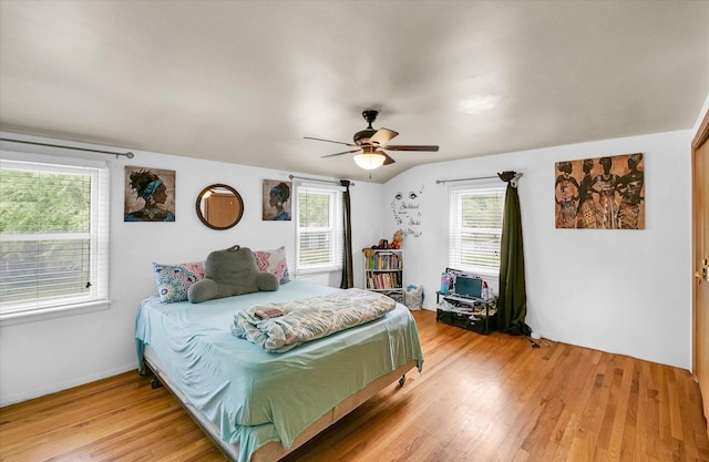 1117 W Springfield Ave, Champaign, IL 61821 - bedroom with light wood-style floors and ceiling fan