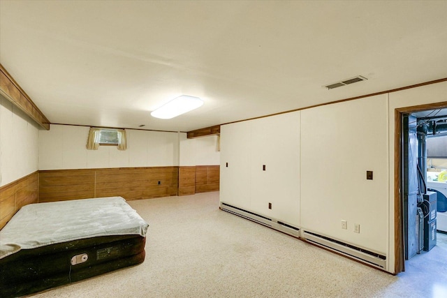 1117 W Springfield Ave, Champaign, IL 61821 - basement featuring a baseboard radiator and wooden walls